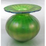 A Loetz style green glass vase, with wide rim and bulbous body,