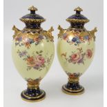 A pair of Royal Crown Derby covered vases, decorated with flowers to a yellow ground, dated 1896,