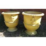 A pair of glazed garden urns, decorated with fleur de lys and rope twist border, diameter 21ins,