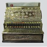 A brass National Cash Register till, decorated with embossed fleur-de-lye,