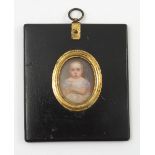 A 19th century portrait miniature, of a young child in white dress with blue ribbon,