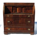 A 19th century Continental mahogany cylinder bureau, with slide out tray and compartments,