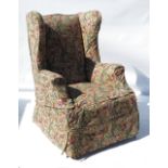 A late 19th century wing armchair,