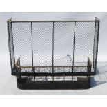 A high mesh D-shaped spark guard fender, with brass top rail, width 48ins,