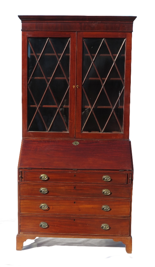 A 19th century mahogany bureau bookcase, the glazed upper section opening to reveal shelves,