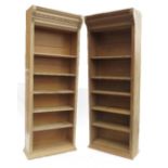 A pair of pine open bookshelves, with fluted sides,