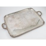 A Mappin and Webb silver two handled tray, with gadrooned edge and scrolling leaf handles,