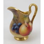 A Royal Worcester jug, hand painted with fruit to a mossy background by J Smith, with gilt interior,