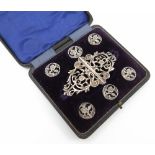 A cased silver buckle and button set,