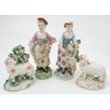 Two 19th century English porcelain models, of sheep, one decorated in gilt, the other in