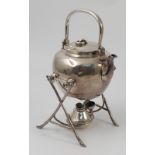 A Chinese white metal spirit kettle on stand, the kettle with ring handle,