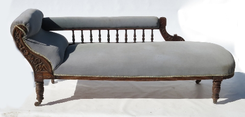 A late 19th century chaise longue, with gallery back and part carved frame,