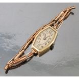 A ladies 9ct gold wrist watch, the dial and case of elongated octagonal shape,