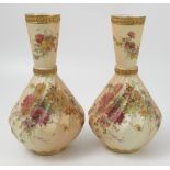 A matched pair of Royal Worcester blush ivory vases,