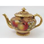 A Royal Worcester tea pot, hand painted with fruit to a mossy background by J Smith, height 6.