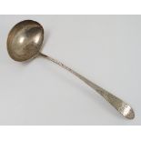 An Irish provincial silver soup ladle, engraved with a crest and initials, marked Gibson Sterling,