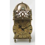 A brass lantern clock, in the Antique style, the bell engraved with presentation inscription,