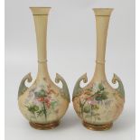 A matched pair of Royal Worcester blush ivory vases, decorated with thistles and flowers,