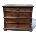 An Antique oak chest, of two short drawers over three long drawers, with fielded drawers, width 42.