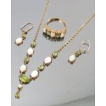 A suite of opal and peridot jewellery, comprising a ring,