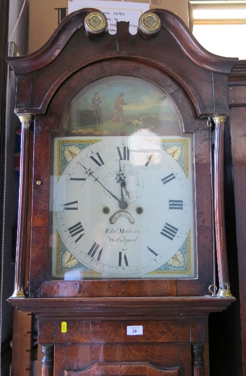 A 19th century oak cross banded long case clock, with arched dial by Edward Matthews of Welshpool,