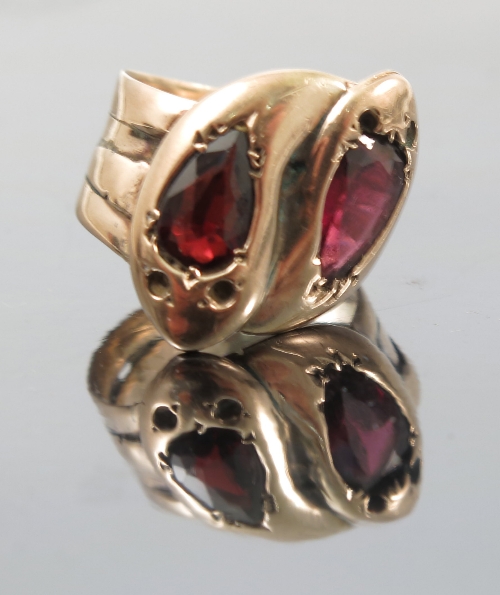 A two stone garnet 9ct gold serpent ring,