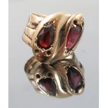 A two stone garnet 9ct gold serpent ring,