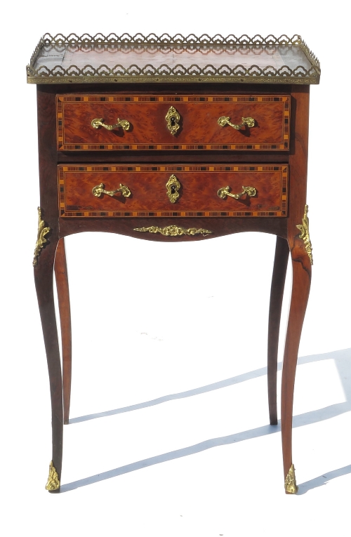 A Continental side cabinet, with cross banded amboyna top,