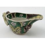 A Chinese porcelain libation cup, decorated in green and yellow with applied dragons, height 2ins