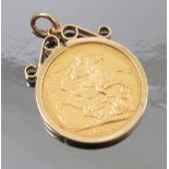An 1872 sovereign, in a 9ct gold scroll top pendant mount, weight 9.