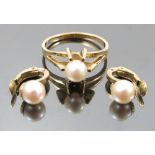 A single stone cultured pearl ring, stamped '585', the pearl of approximately 6.