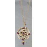 An Edwardian amethyst and seed pearl pendant, on a chain, the pendant tagged '15ct',