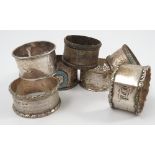 Seven various hallmarked silver napkin rings, to include a pair with engraved decoration,