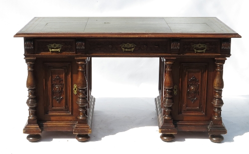 A mahogany desk, fitted three frieze drawers with blind fret carving,