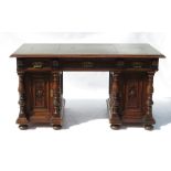 A mahogany desk, fitted three frieze drawers with blind fret carving,
