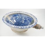 A 19th century Staffordshire blue and white printed toilet, with leaf decorated edge,