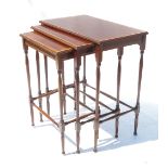 A nest of three mahogany Edwardian tables, of rectangular form,