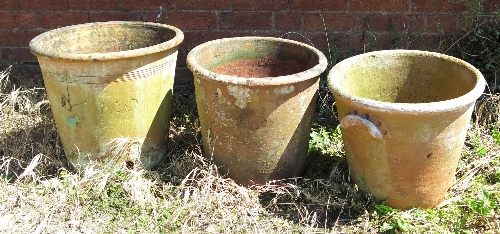 Three large clay pots,