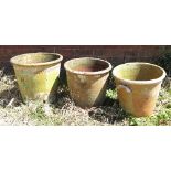 Three large clay pots,