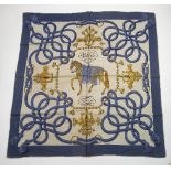 A Hermes Paris silk scarf, in the 'Palefroi' design, with central horse to bells and rope border,