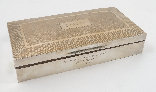 A silver cigarette box, of rectangular form, with engine turning,