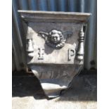 A lead rainwater hopper, bearing date 1712,