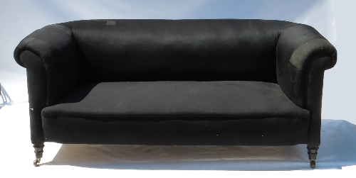 A 19th century Chesterfield, raised on short tapering turned legs,