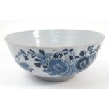 An 18th century Delft tin glazed bowl, decorated to the exterior with blue flowers, af, diameter 9.