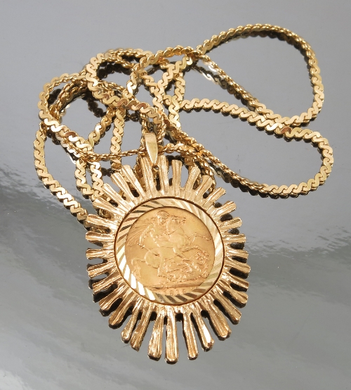 A 1912 sovereign, in a 9ct gold star burst style pendant mount, on a fancy link 9ct gold chain,