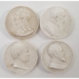 A collection of sixteen Grand Tour plaster medallions, all relief moulded with portraits and text,