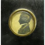 A 19th century portrait silhouette with gilt highlight, inscribed Norcott 1844, diameter 2.