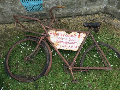 A tradesman bicycle, in very poor condition, fitted with enamel sign,