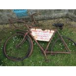 A tradesman bicycle, in very poor condition, fitted with enamel sign,