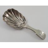 A Georgian silver fiddle pattern caddy spoon, with fluted bowl,